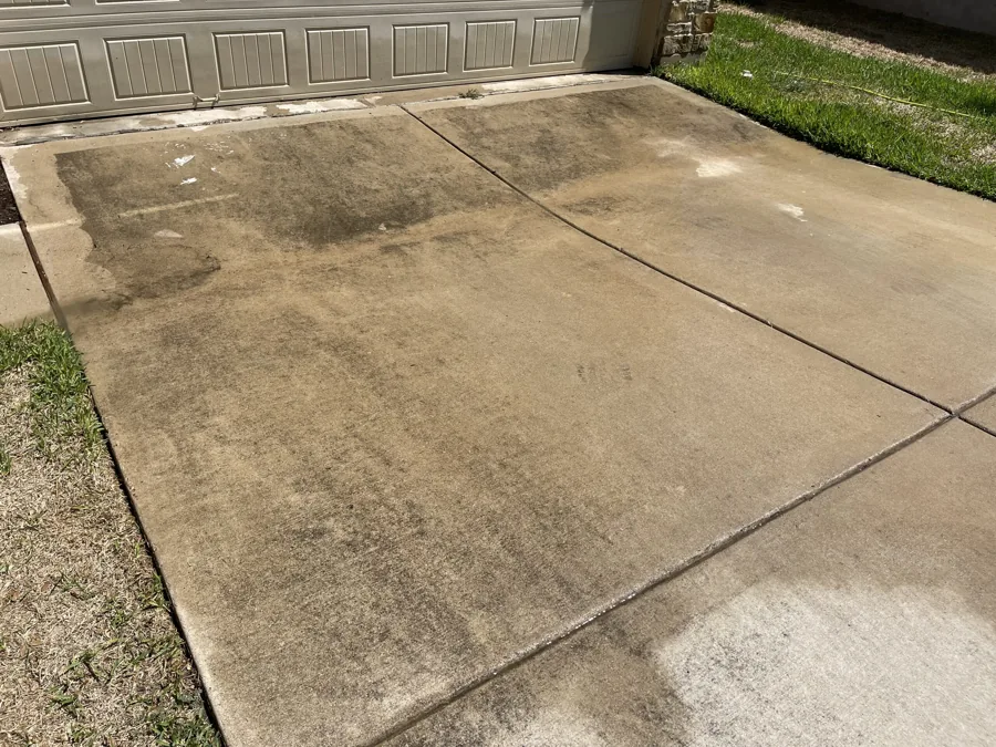 Driveway before pressure washing