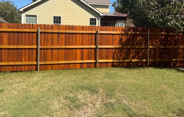 Cedar Tone stain on a cedar privacy fence stained by Stain Guys