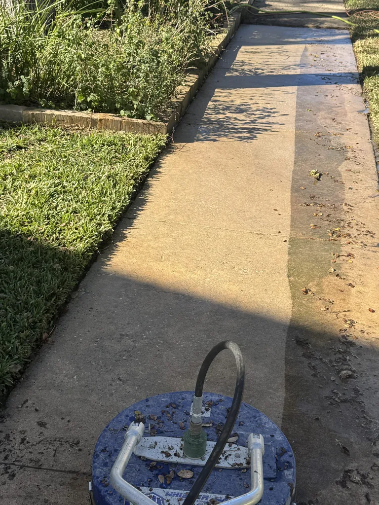 Surface cleaner pressure washing a concrete patio